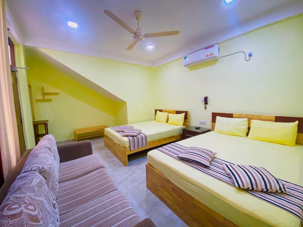 Postel nebo postele na pokoji v ubytování Sparkling Resort Kataragama