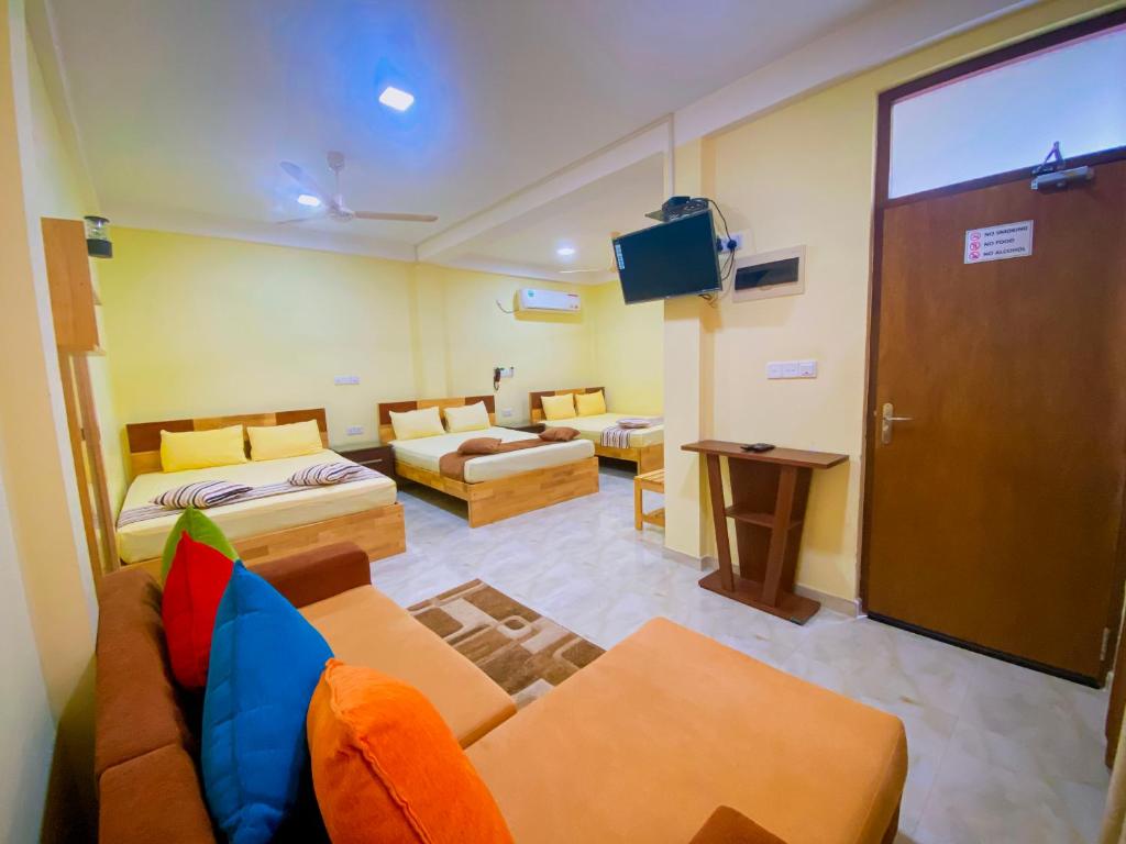 Postel nebo postele na pokoji v ubytování Sparkling Resort Kataragama