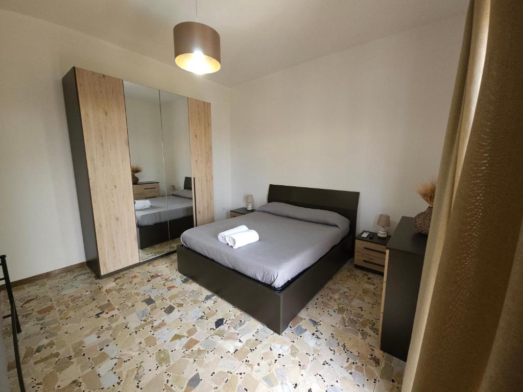 Postel nebo postele na pokoji v ubytování La terrazza del borgo