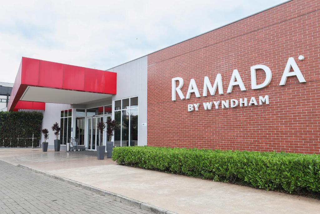 a red brick building with the words ramada by vaughan at Ramada by Wyndham Campinas Viracopos in Campinas