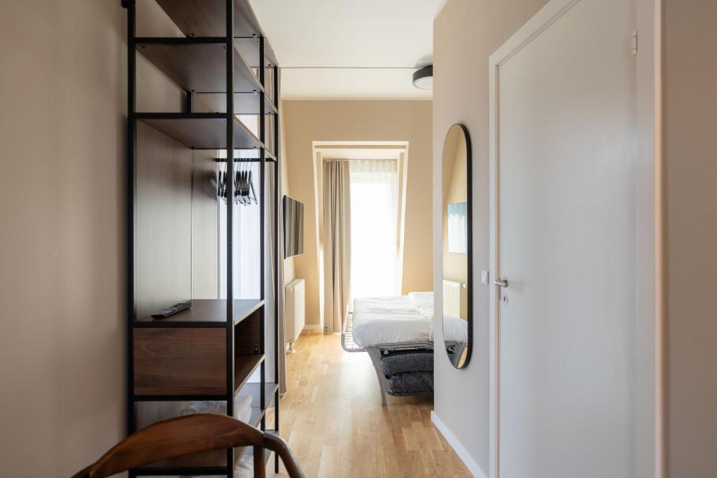 Postel nebo postele na pokoji v ubytování Numa Copenhagen Nørrebro