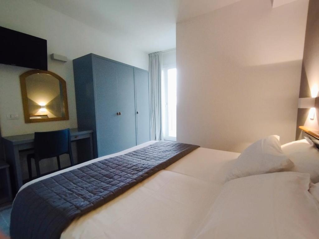 Posteľ alebo postele v izbe v ubytovaní Hotel Excelsior