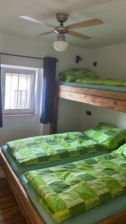 Postel nebo postele na pokoji v ubytování Penzion s rafty