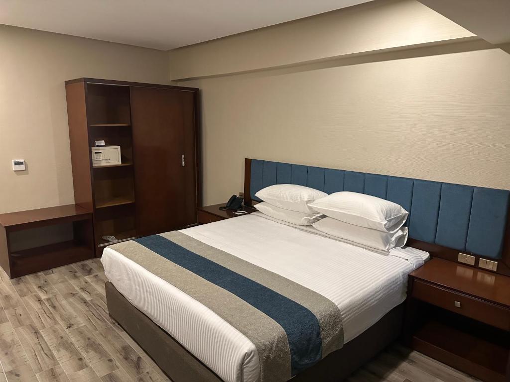 Postel nebo postele na pokoji v ubytování Stay Inn Pyramids Hotel