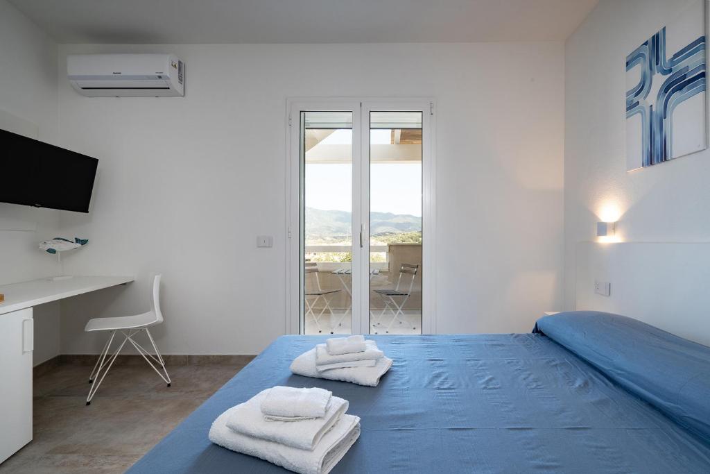 Postel nebo postele na pokoji v ubytování Su Mari Rooms