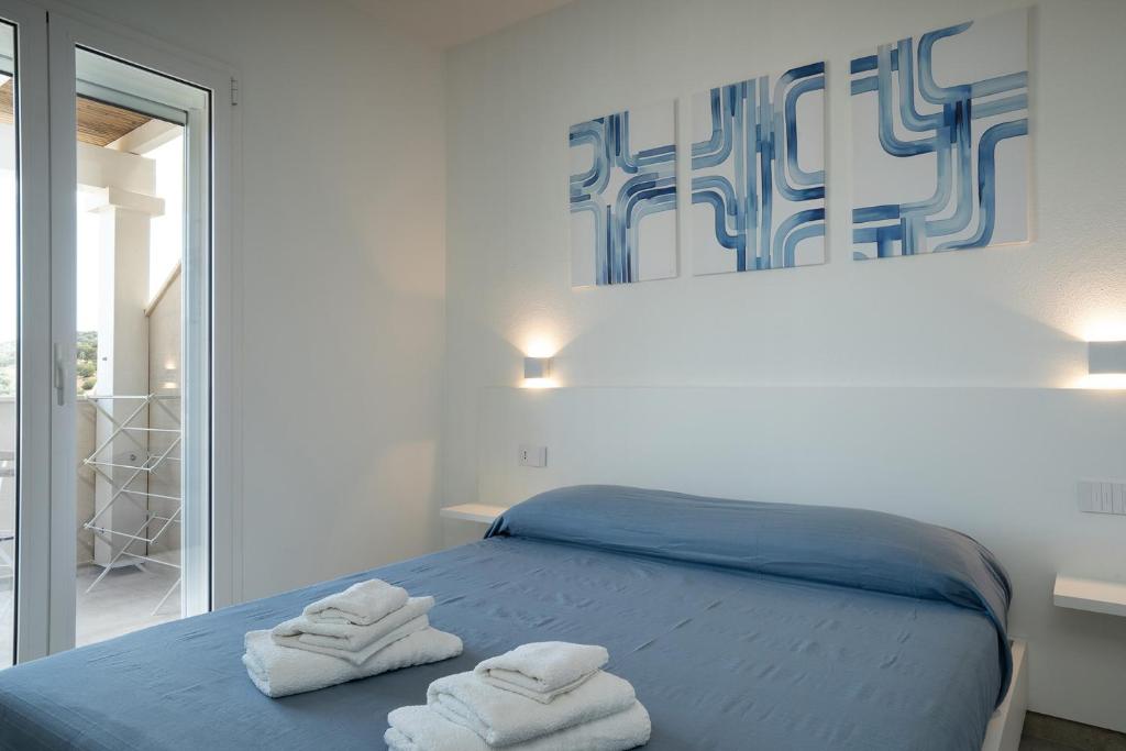 Postel nebo postele na pokoji v ubytování Su Mari Rooms