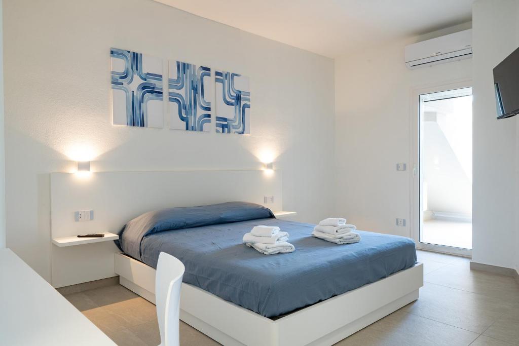 Postel nebo postele na pokoji v ubytování Su Mari Rooms