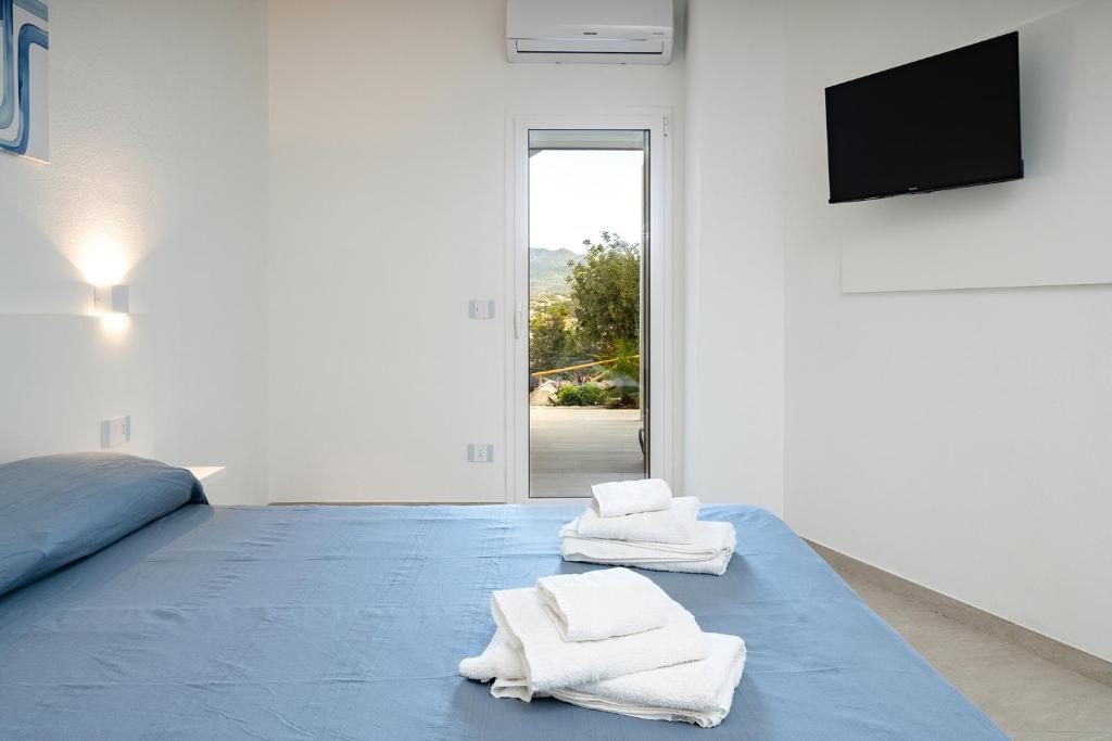 Postel nebo postele na pokoji v ubytování Su Mari Rooms