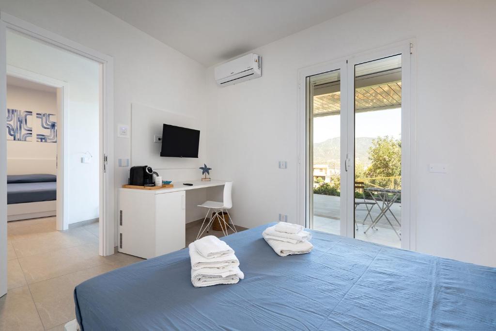 Postel nebo postele na pokoji v ubytování Su Mari Rooms