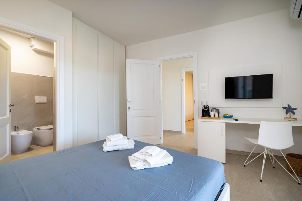 Postel nebo postele na pokoji v ubytování Su Mari Rooms