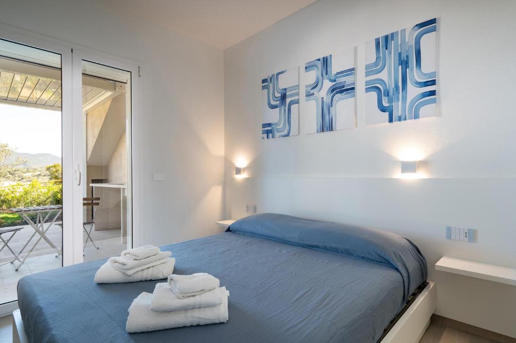 Postel nebo postele na pokoji v ubytování Su Mari Rooms