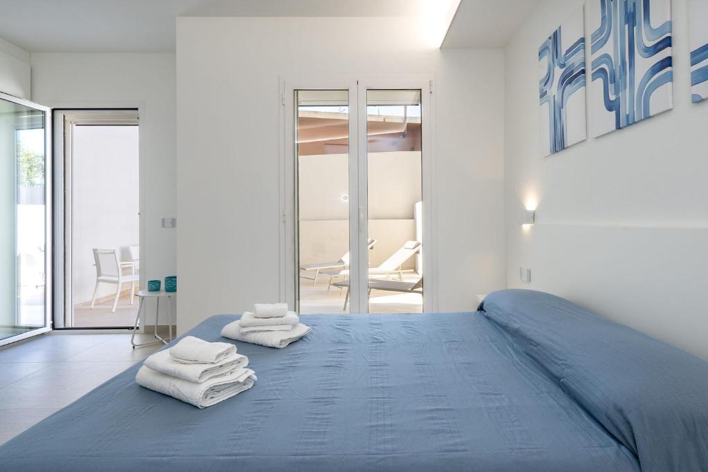 Postel nebo postele na pokoji v ubytování Su Mari Rooms