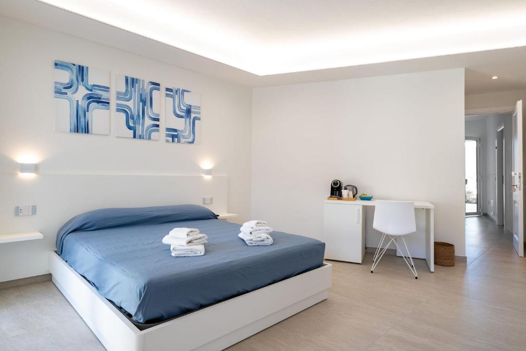 Postel nebo postele na pokoji v ubytování Su Mari Rooms