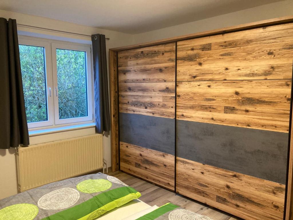 Postel nebo postele na pokoji v ubytování Ferienwohnung Weissensteiner Steinbach
