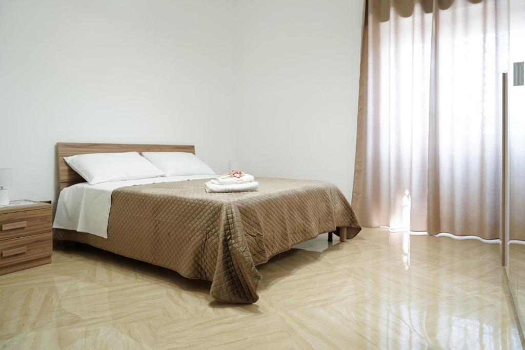 Postel nebo postele na pokoji v ubytování Vesuvius Home