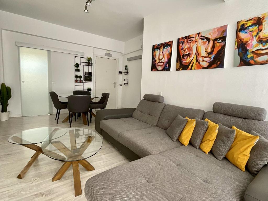 a living room with a couch and a table at Santa Cruz Luxury Low-Cost Apartment with Terrace & Views in Santa Cruz de Tenerife
