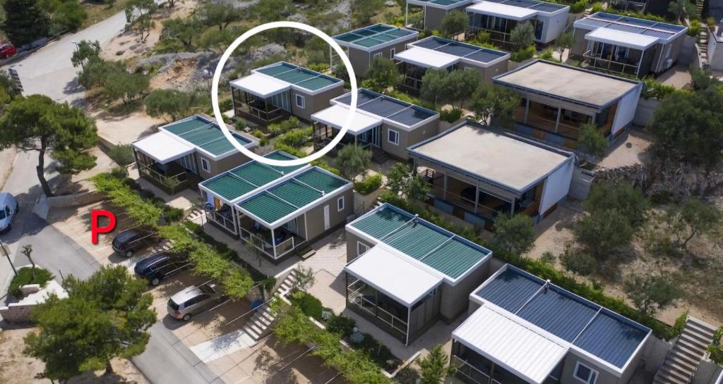 an overhead view of a bunch of houses with roofs at Mobile House Emma, Camp Rehut , Murter in Murter