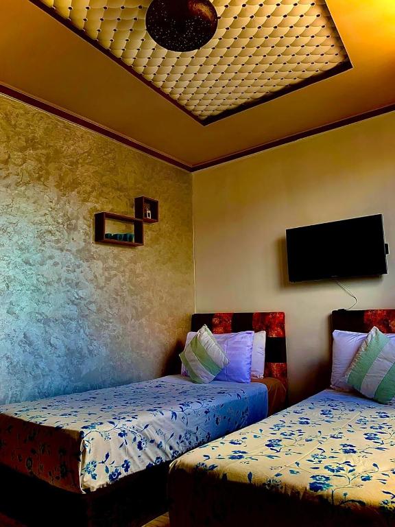Postel nebo postele na pokoji v ubytování hôtel dar nokhba