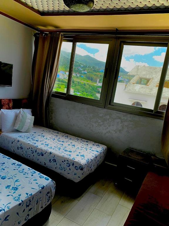 Postel nebo postele na pokoji v ubytování hôtel dar nokhba