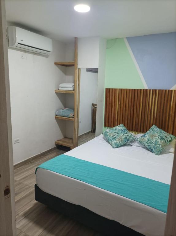 Postel nebo postele na pokoji v ubytování Hostal Catalleya