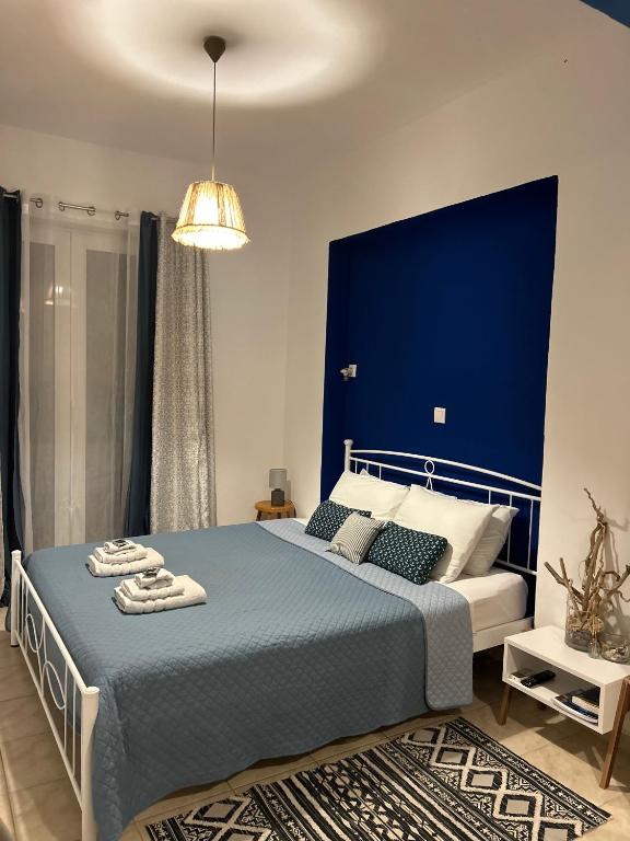 Postel nebo postele na pokoji v ubytování Haraki Blue Horizon