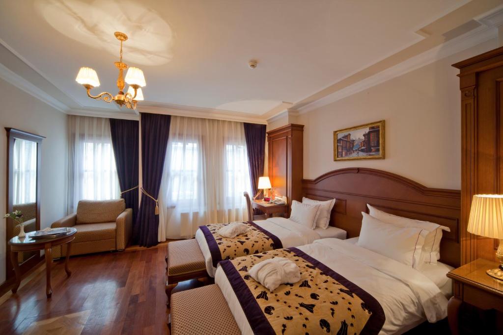Postel nebo postele na pokoji v ubytování GLK PREMIER The Home Suites & Spa
