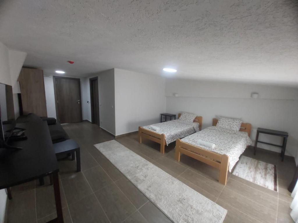Postel nebo postele na pokoji v ubytování Vila Kruna