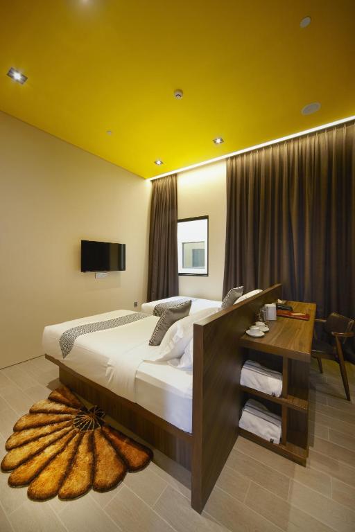 Postel nebo postele na pokoji v ubytování Hotel Yan