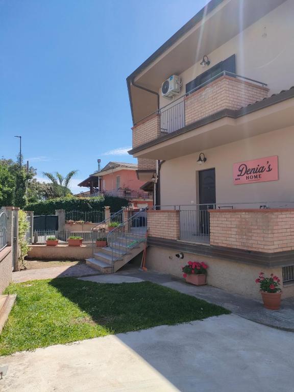 a building with a sign on the side of it at DENIA'S HOME in SantʼEufemia Lamezia