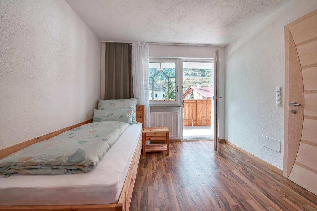 Postel nebo postele na pokoji v ubytování Baienhof