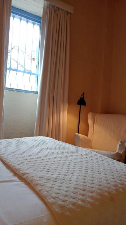 Postel nebo postele na pokoji v ubytování Candelaria House Boutique