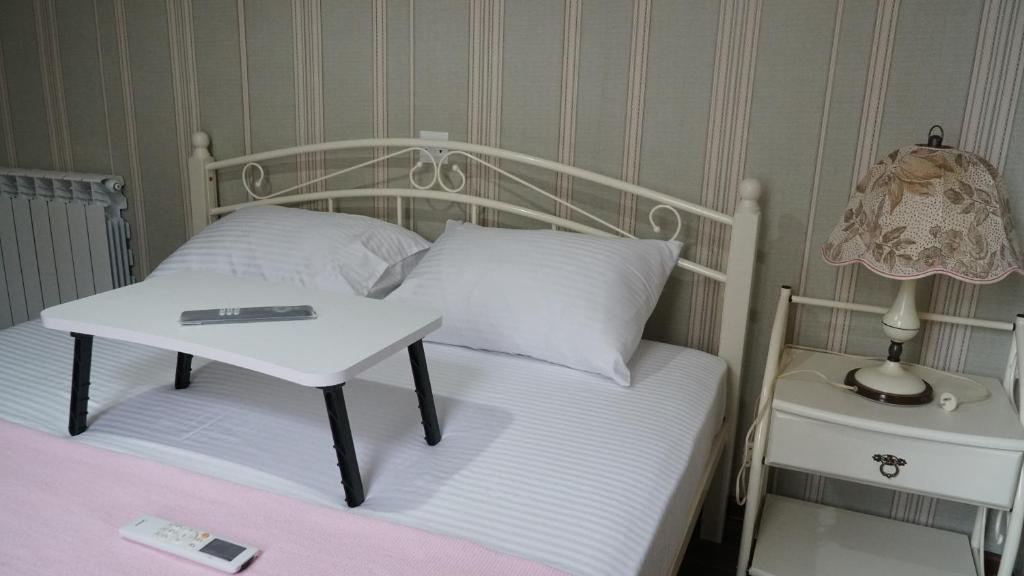 Postel nebo postele na pokoji v ubytování Eleven Guest House