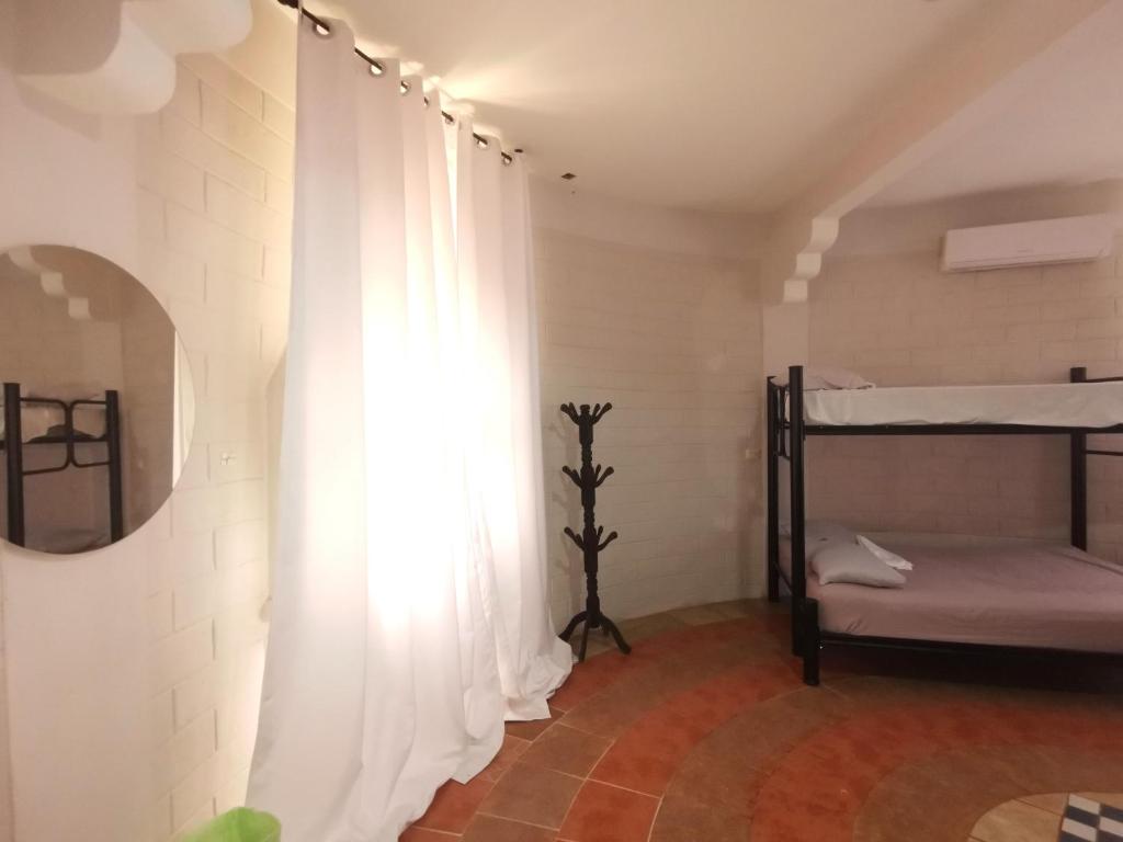 Postel nebo postele na pokoji v ubytování Mitico El Castillo