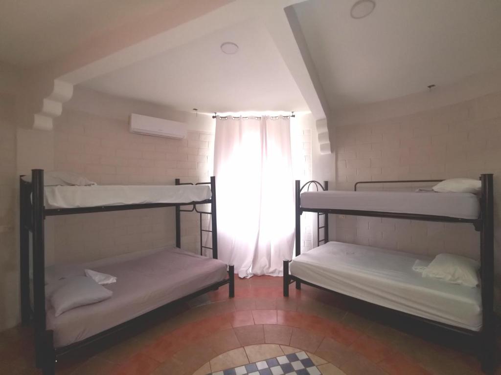 Postel nebo postele na pokoji v ubytování Mitico El Castillo