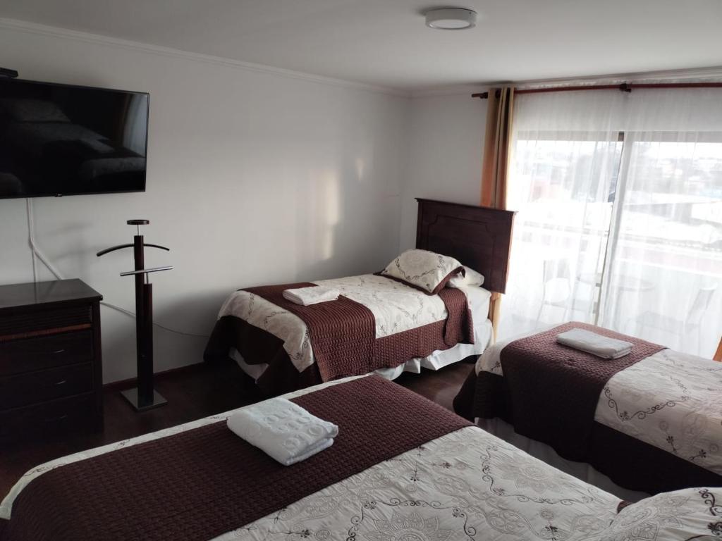 Postel nebo postele na pokoji v ubytování HOTEL QUINTA ESTACIÓN