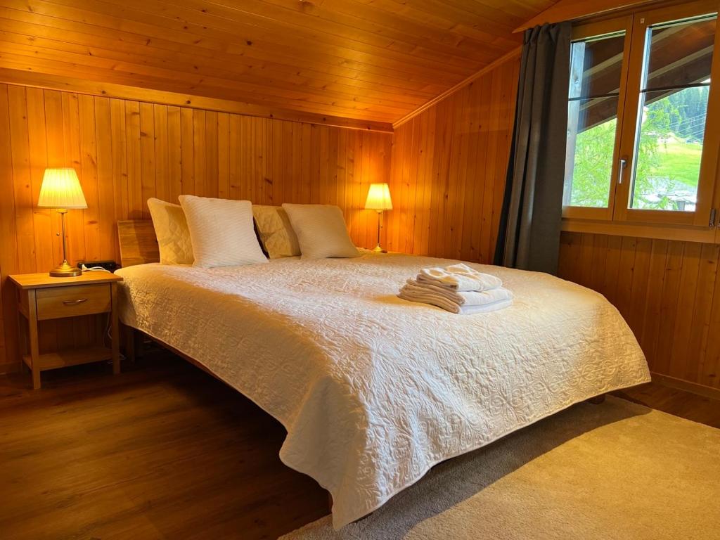 Postel nebo postele na pokoji v ubytování Chalet Diablerets