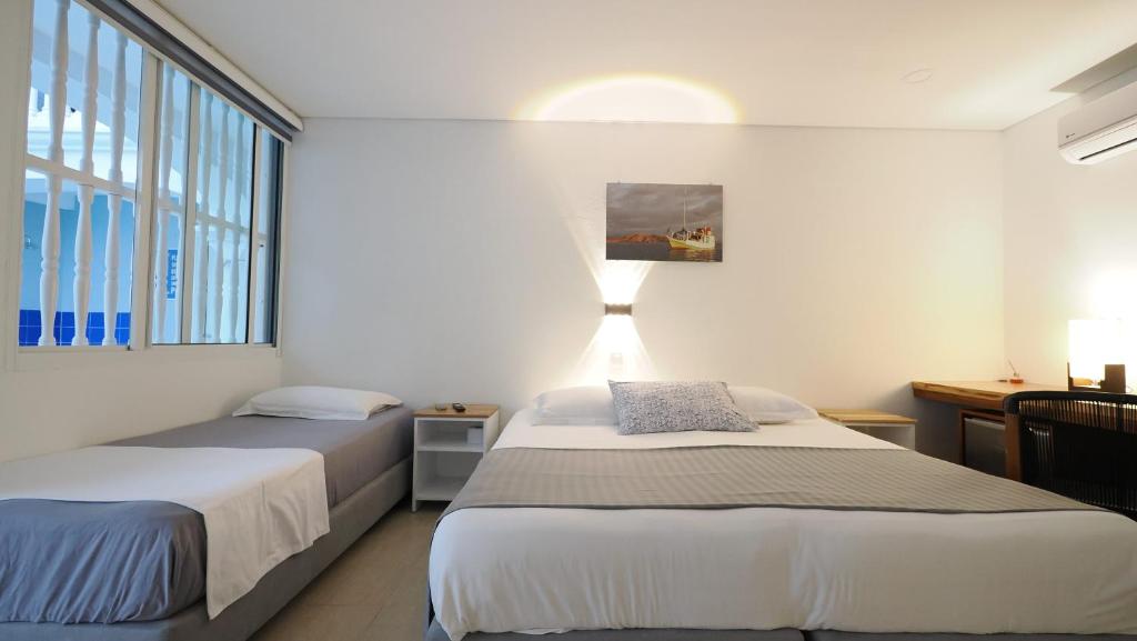 Postel nebo postele na pokoji v ubytování Hotel Casa Cytia
