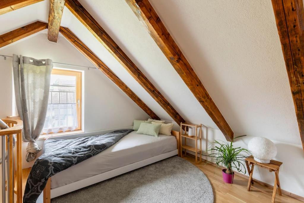 a bedroom with a bed in a attic at Idyllic holiday home - relaxation place in Leibnitz