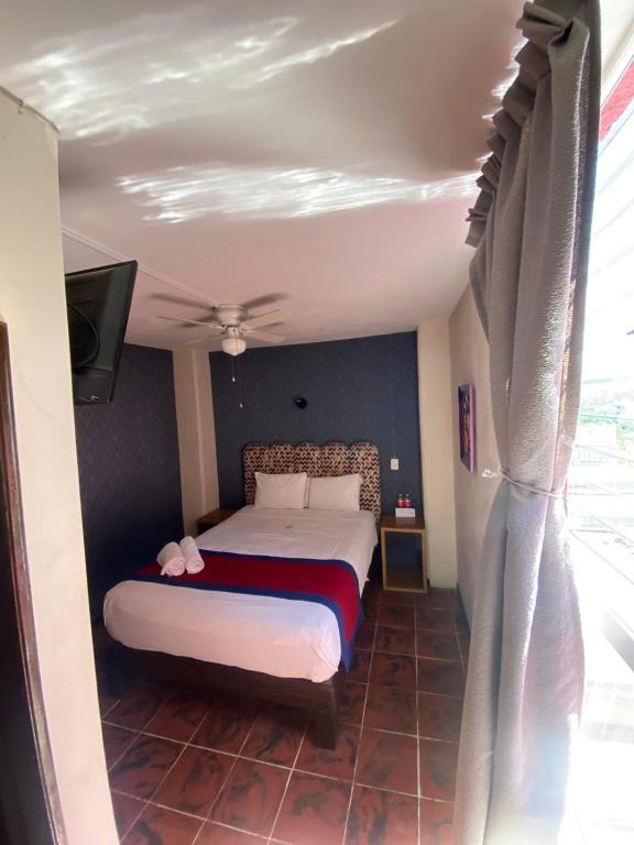 Postel nebo postele na pokoji v ubytování Hotel Flamingos