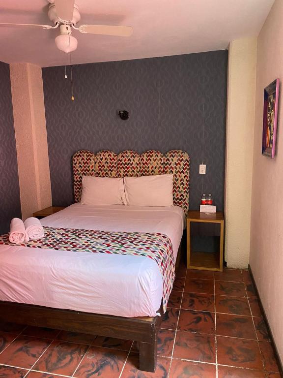 Postel nebo postele na pokoji v ubytování Hotel Flamingos