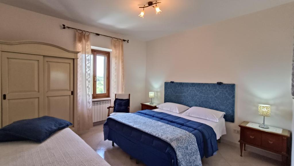 Postel nebo postele na pokoji v ubytování Il Fiordaliso