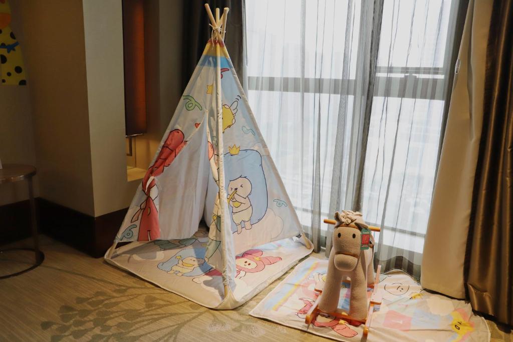 Postel nebo postele na pokoji v ubytování Crowne Plaza Hefei by IHG