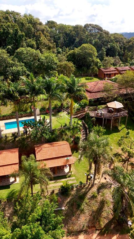 an aerial view of a resort with trees and a pool at Pousada Caruaru in Socorro