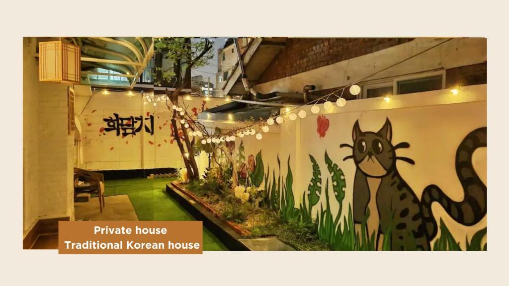 a room with a painting of a horse on the wall at K-culture house, seoul in Seoul