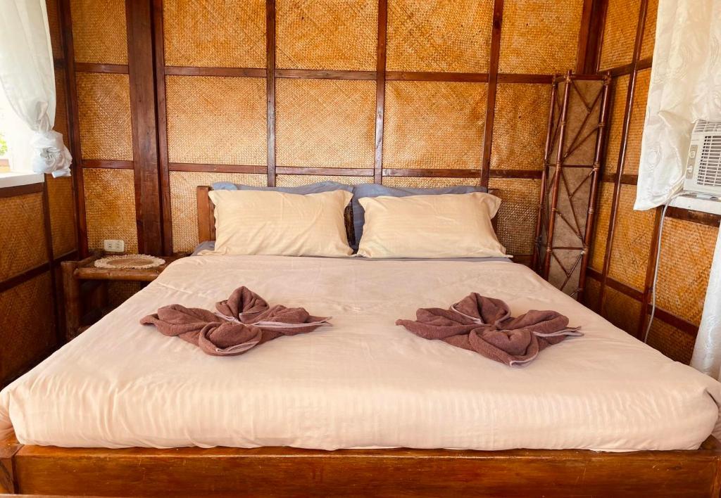Letto o letti in una camera di Abihon HoferHaus Mactan Guesthouse
