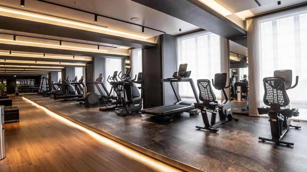 a gym with a row of treadmills and machines at Shinagawa Prince Hotel N Tower in Tokyo