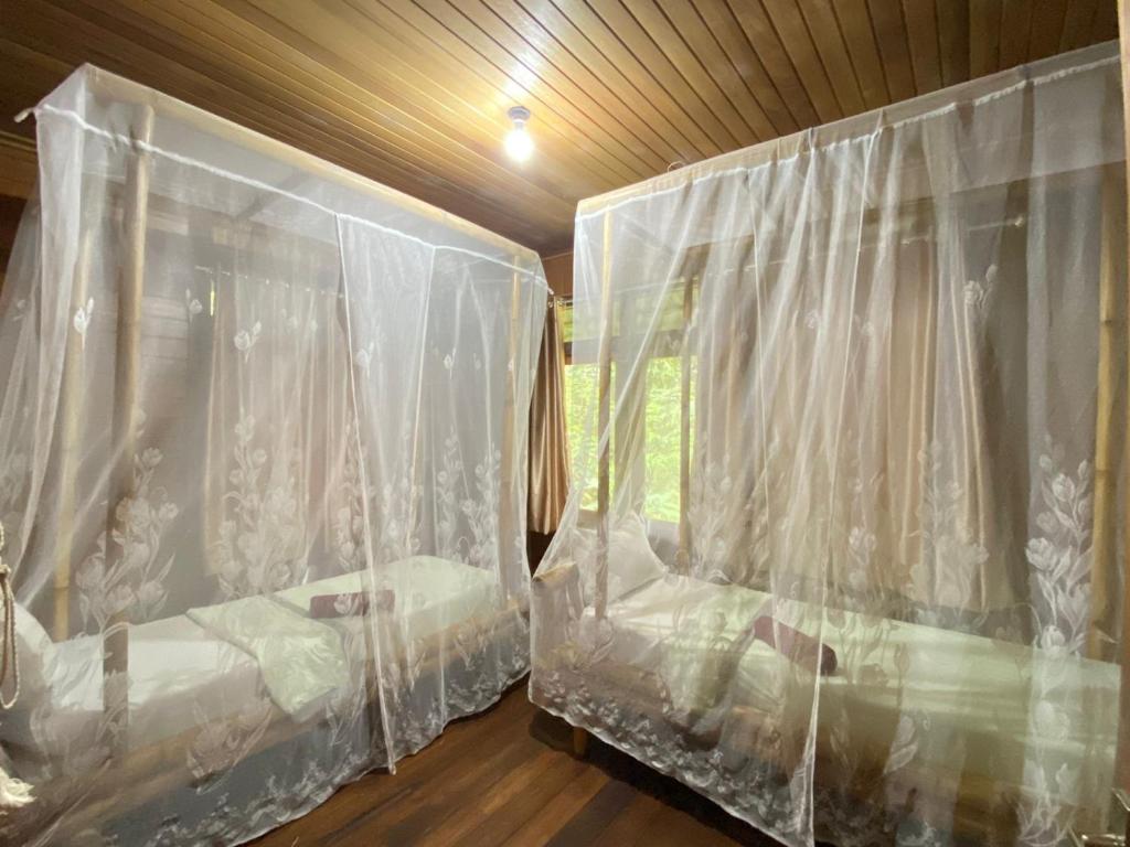 Postel nebo postele na pokoji v ubytování Rimba eco Resort