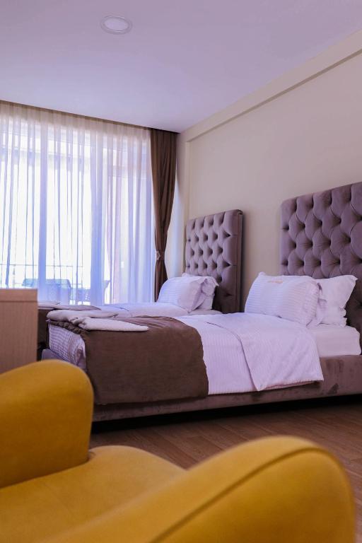 Postel nebo postele na pokoji v ubytování Hotel Frojd - Beach Front Resort