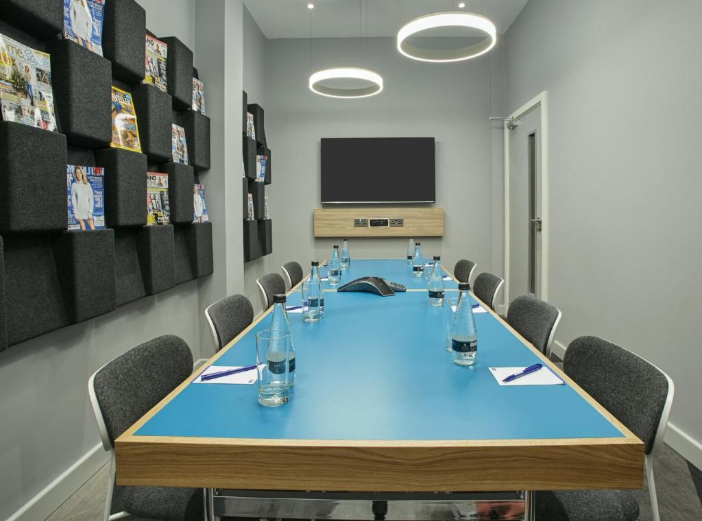 a conference room with a long table and chairs at Holiday Inn Express Ajaccio by IHG in Ajaccio