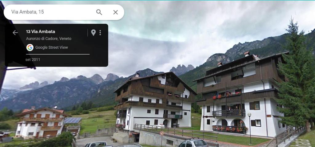 a screenshot of a website with a picture of buildings at Appartment Ambata in Auronzo di Cadore